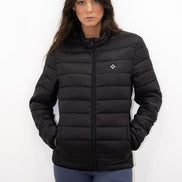 Woman wearing a black puffer jacket on a white background