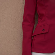 Red jacket with a textured beige background